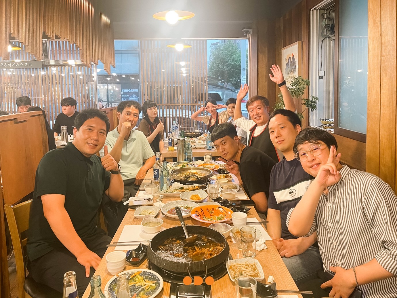 A group of people sitting at a table with food
Description automatically generated with medium confidence